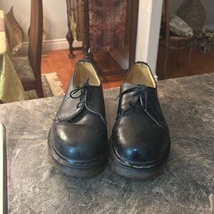 Men’s used Dr. Martens black Oxford shoes.